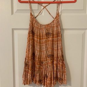 Free people criss cross tank- small tear